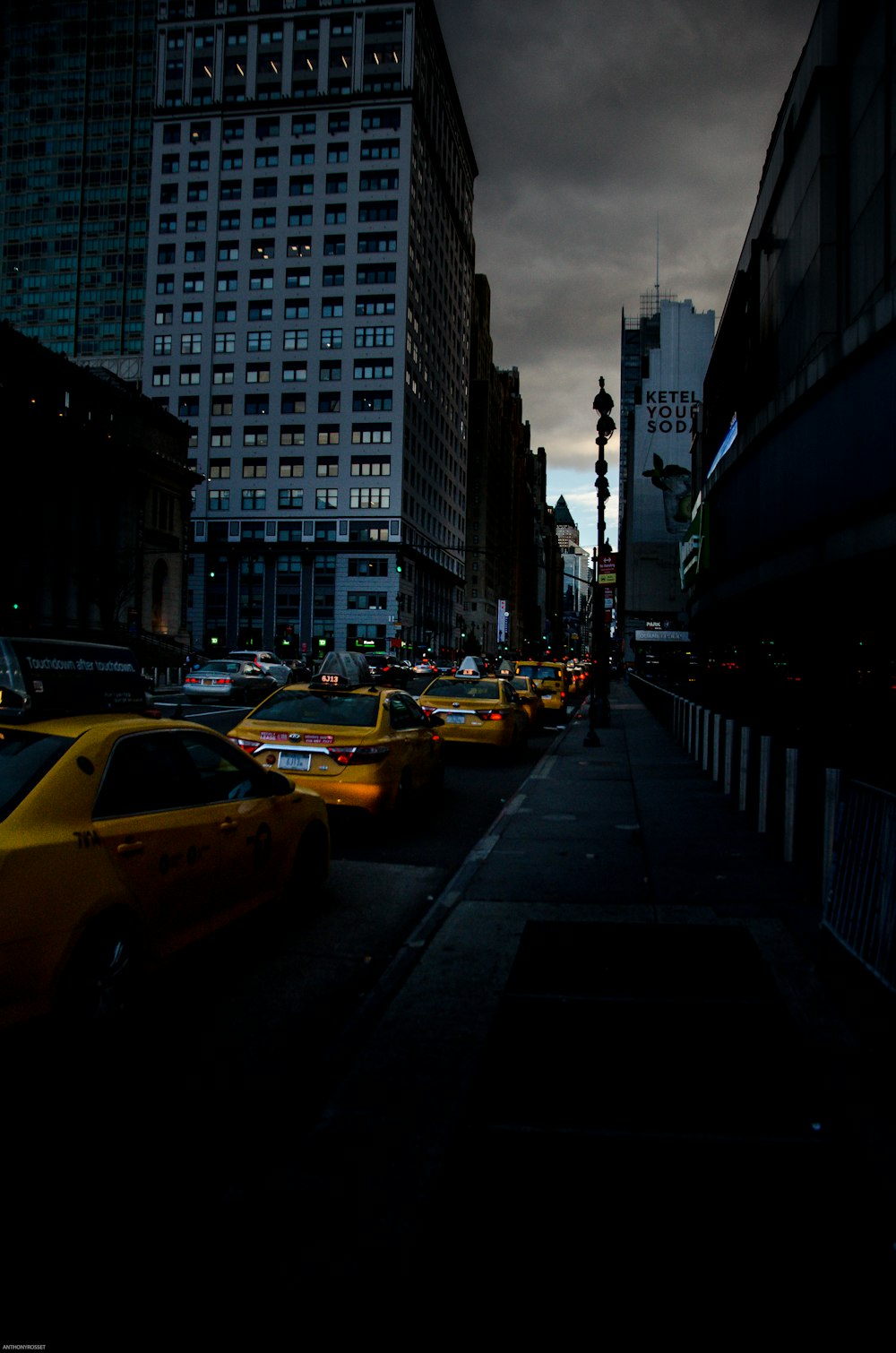 red taxi near buildings