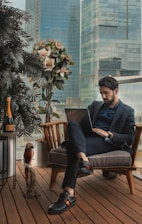 man sitting beside side table