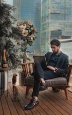 man sitting beside side table