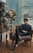 man sitting beside side table