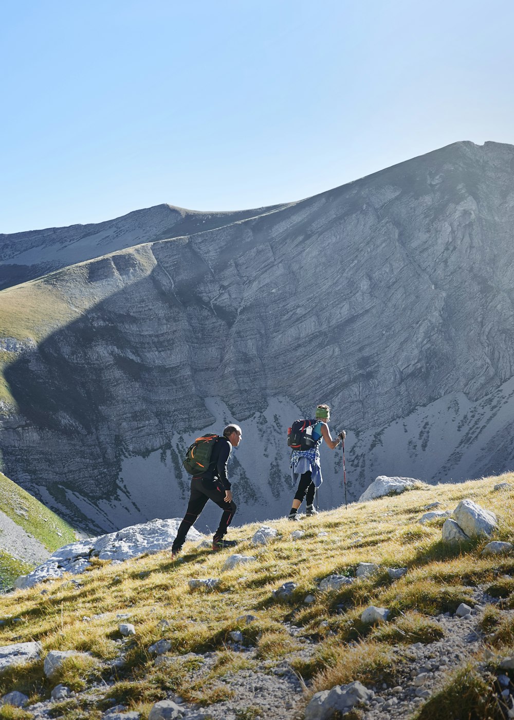 two people walking on mountain