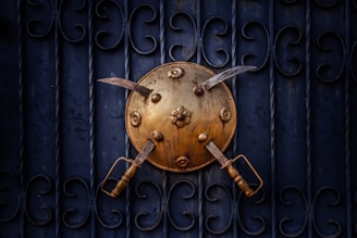 two silver swords on shield