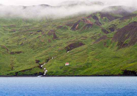 house on mountain slope in Skjálfandi Iceland
