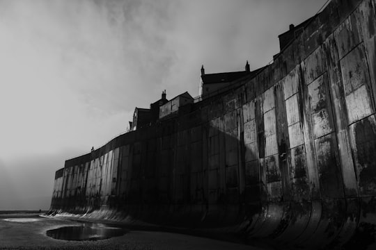 grayscale photography of building in Robin Hood's Bay United Kingdom
