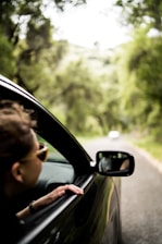 woman sitting inside vehicle
