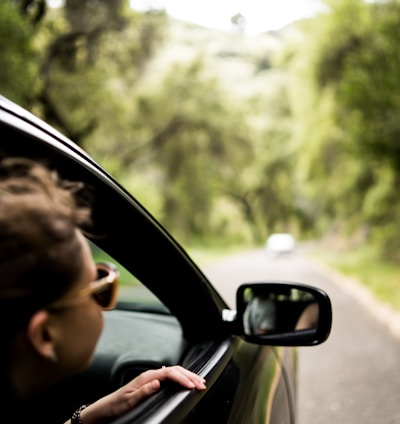 woman sitting inside vehicle