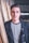 man standing beside wood planks