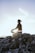 A serene man meditating outdoors at sunrise, symbolizing inner peace and personal growth.