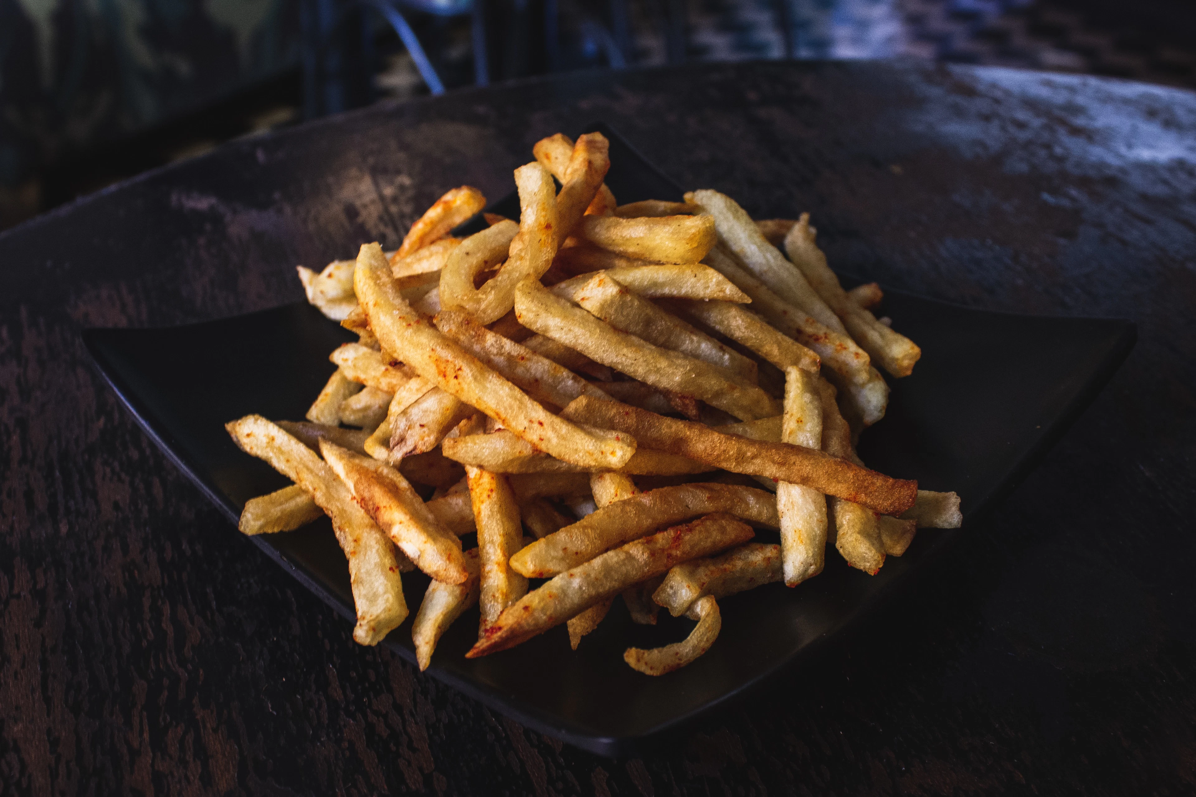 Crisp golden fried pieces on a dark plate