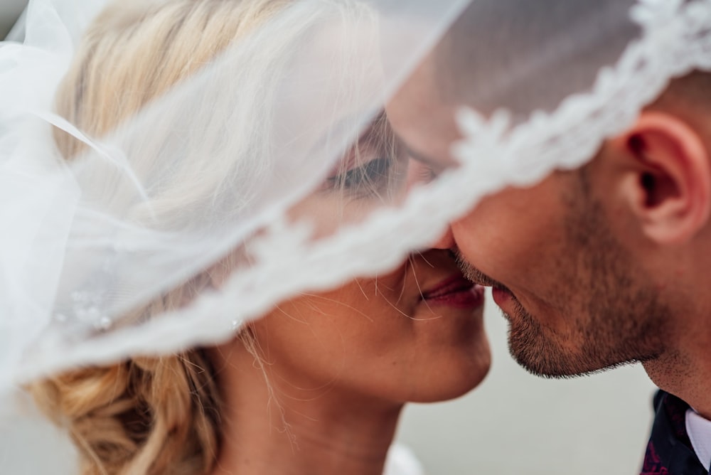 bride and groom about to kiss