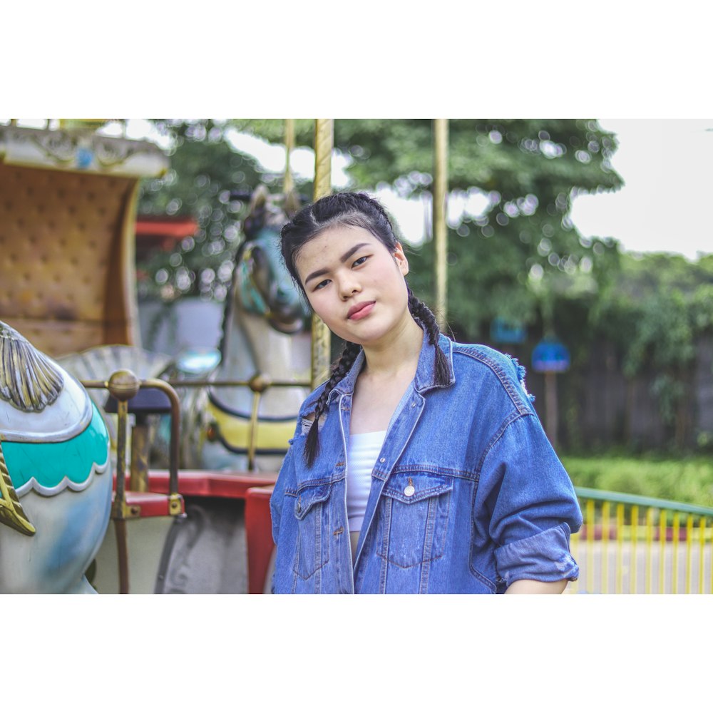 woman wearing blue denim button-up jacket