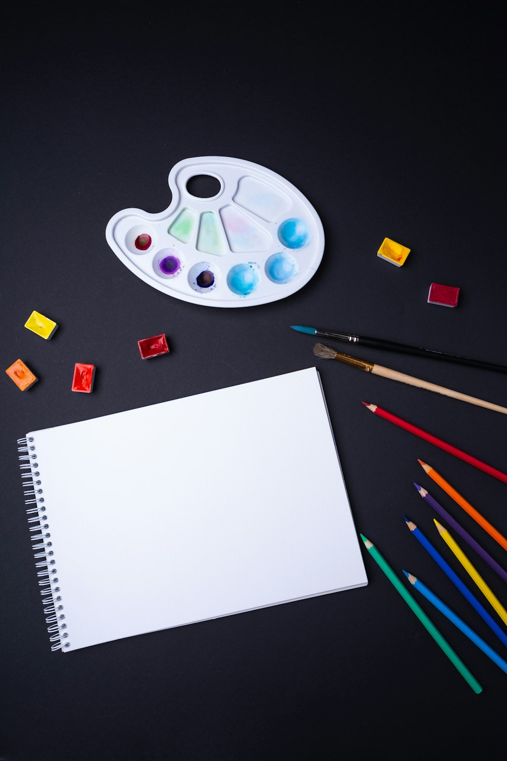 Sketch pad with color pencil and paint brush photo – Free Ukraine Image on  Unsplash