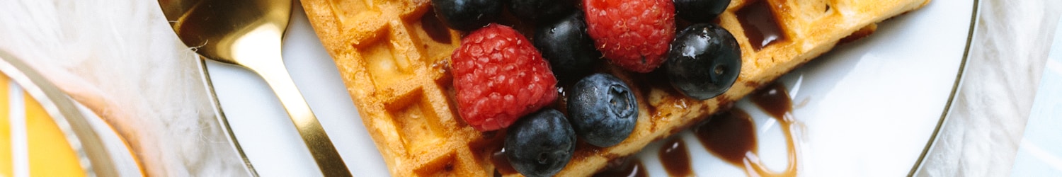 sandwich with strawberry and blackberry fruits on plate