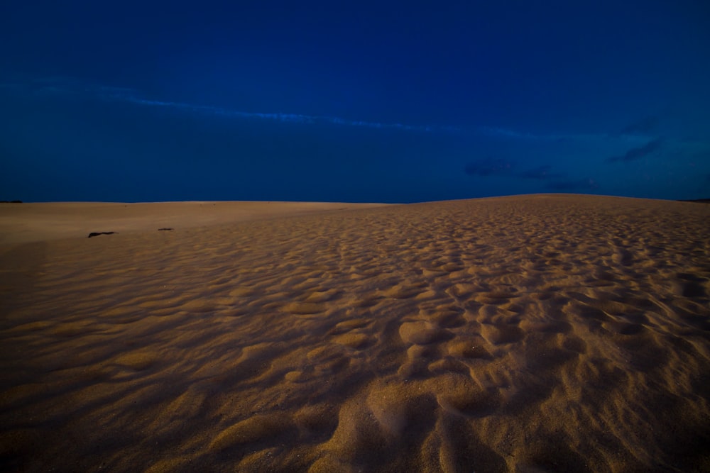 sandy area under blue sky