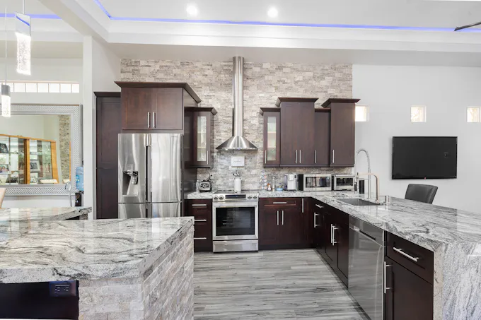 Silver French-door Frigidaire-style refrigerator in a home kitchen serviced by an Altoona appliance repair technician