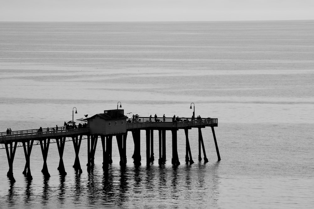 black dock in the body of water during daytime