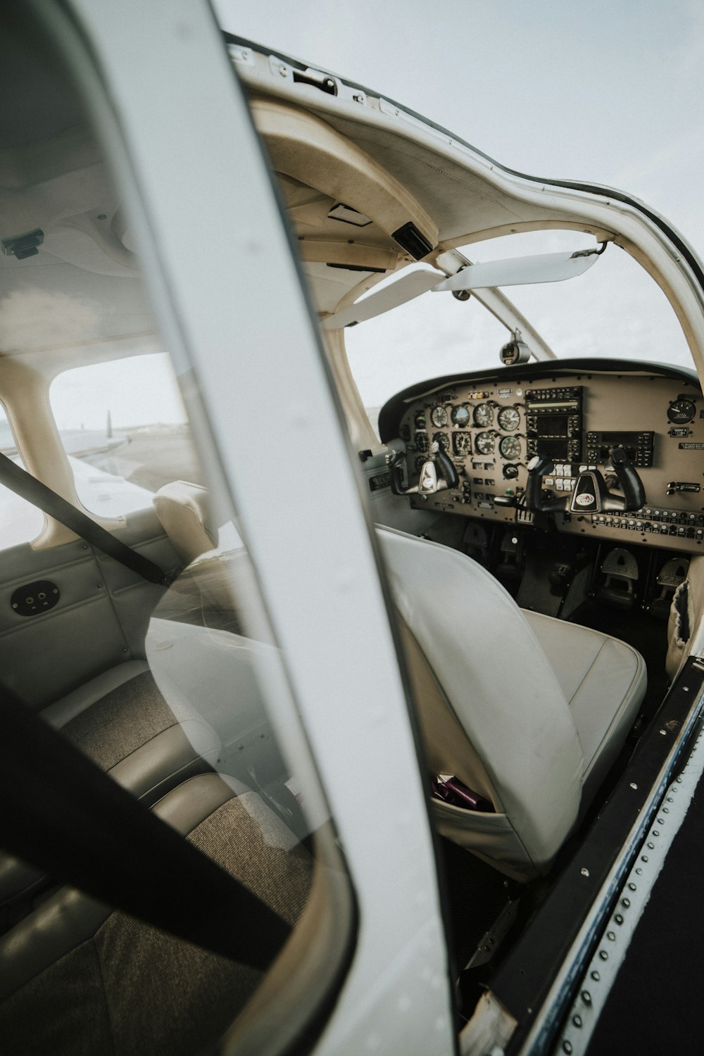 close-up photography of white plane seat