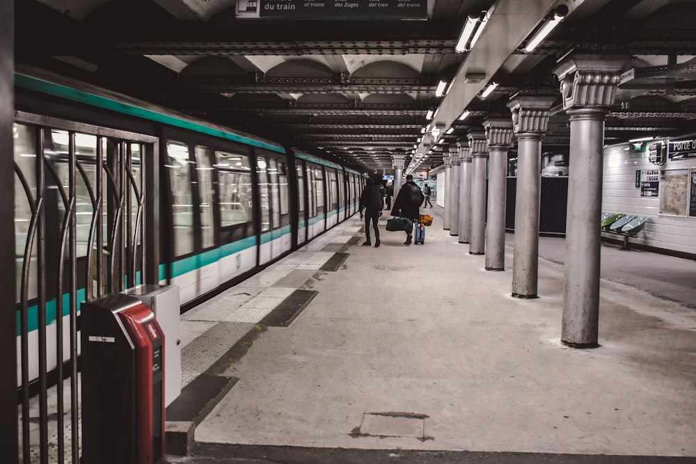 two persons near train