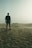 silhouette of man standing on sand