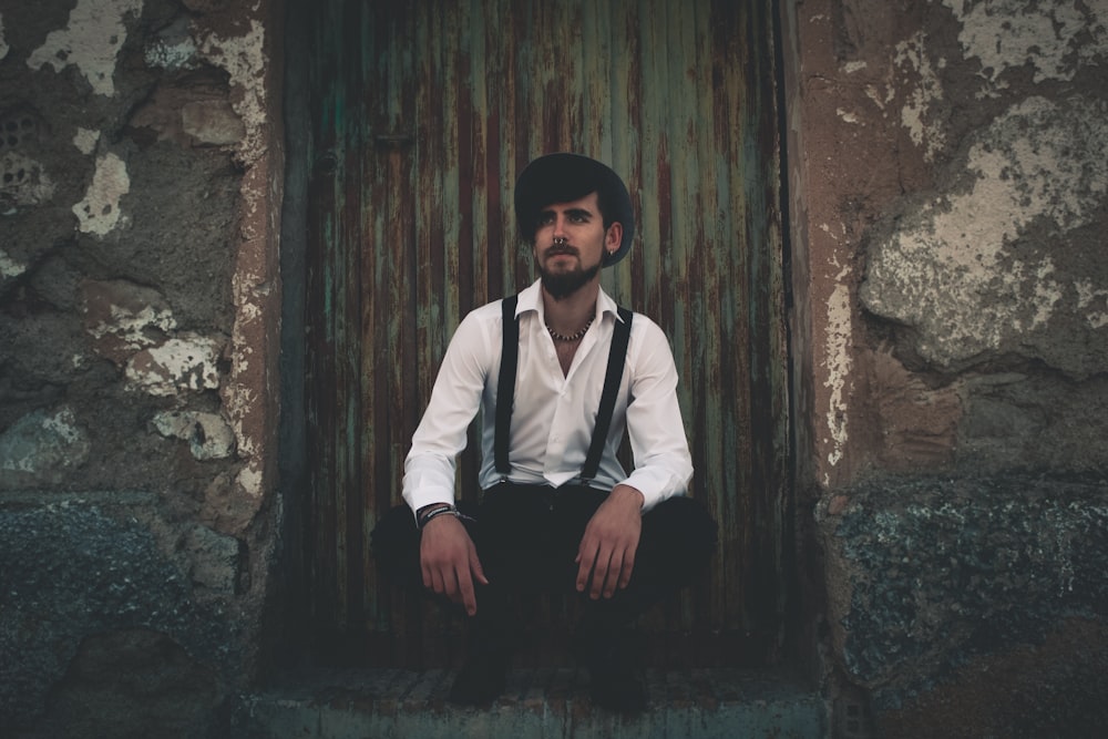 man sitting near door