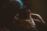 A close-up of hands holding a comforting object.
