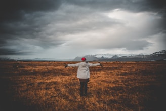 person standing of grass field