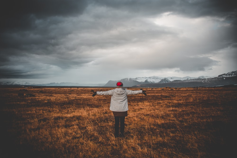 person standing of grass field