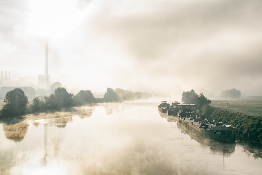 ship on body of water with fogs