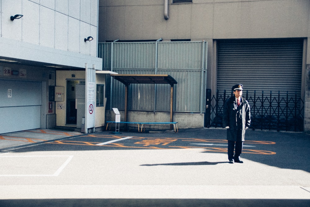 man standing near building