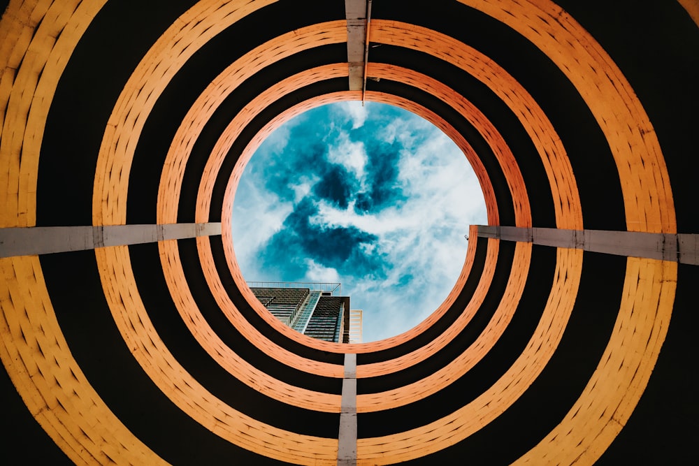 view of building under white cloudy blue sky from hole