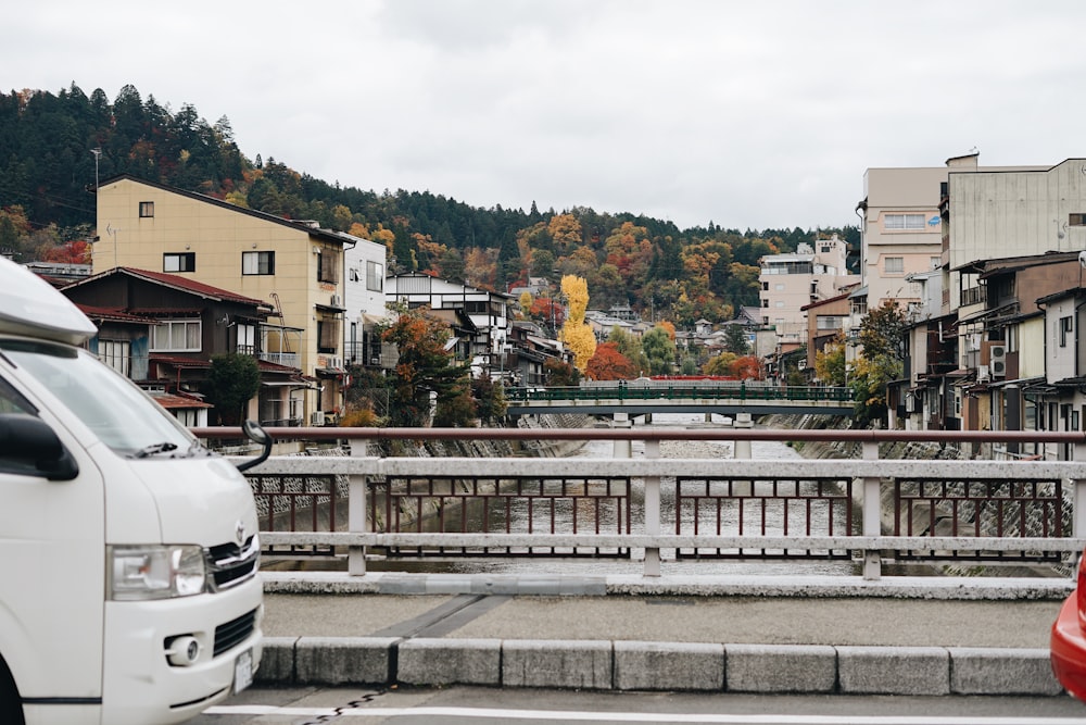 parked white vehicle on bridge