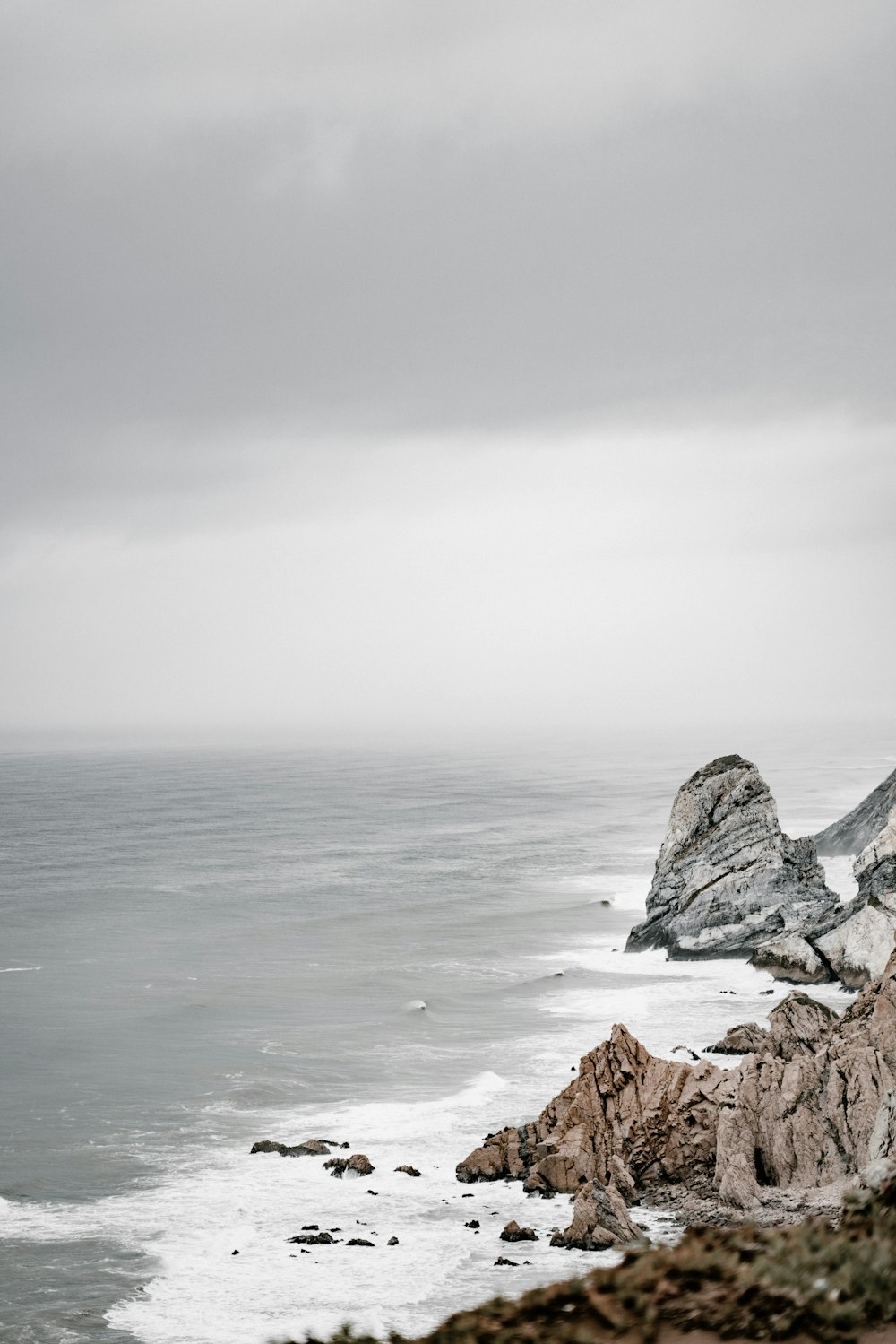 rocky mountain near the ocean photography