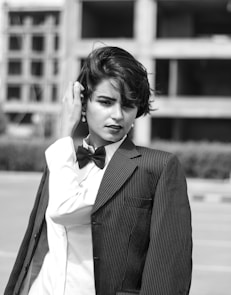 grayscale photography of Lily Collins in suit jacket