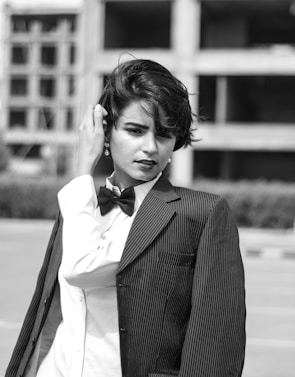 grayscale photography of Lily Collins in suit jacket