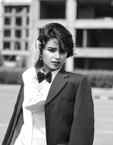 grayscale photography of Lily Collins in suit jacket