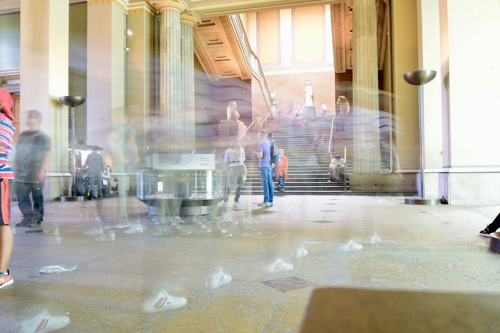 time lapse photography of people inside room