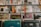 A collection of vinyl records is neatly organized on shelves. The records feature colorful and varied cover art, showcasing different music genres such as soul, funk, and hip hop. The record sleeves are arranged in rows, with some covers displaying artwork and text that are prominent and visually engaging.