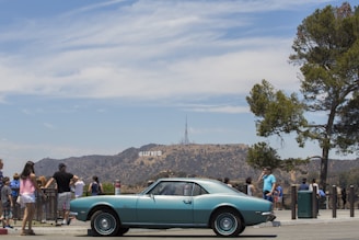 A comfortable vehicle ready for transportation, parked near a famous landmark.