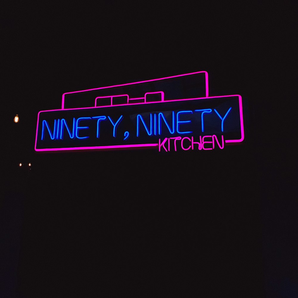 pink and blue Ninety Ninety neon signage