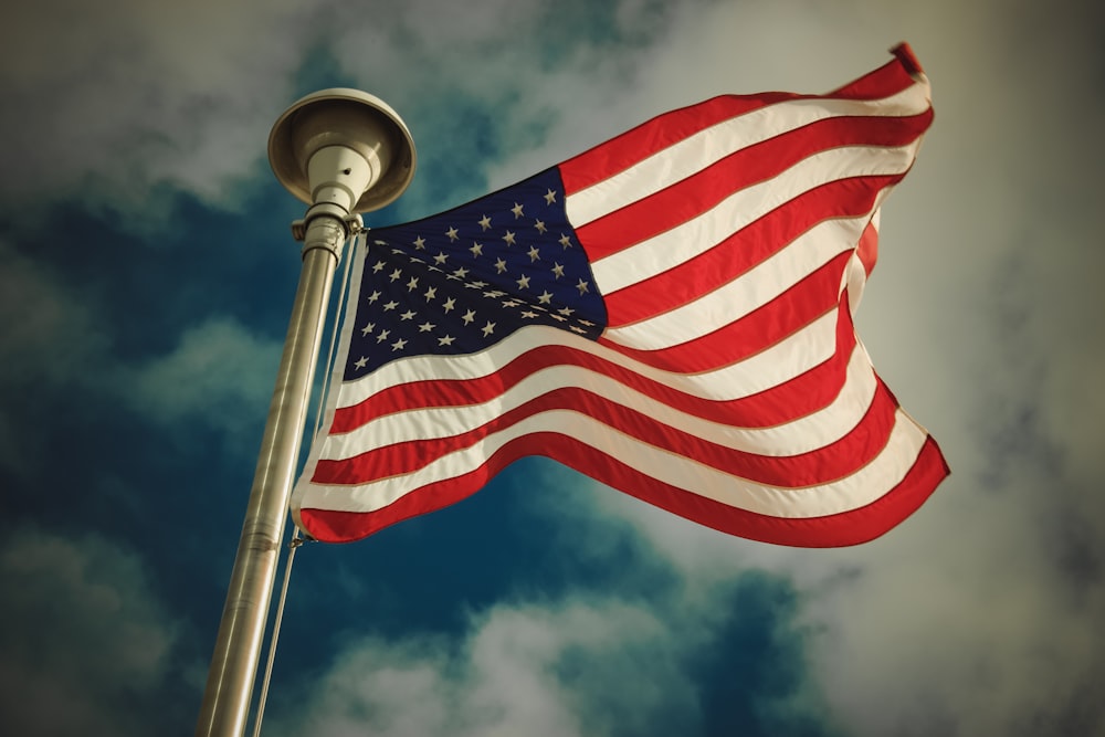 waving US flag during daytime