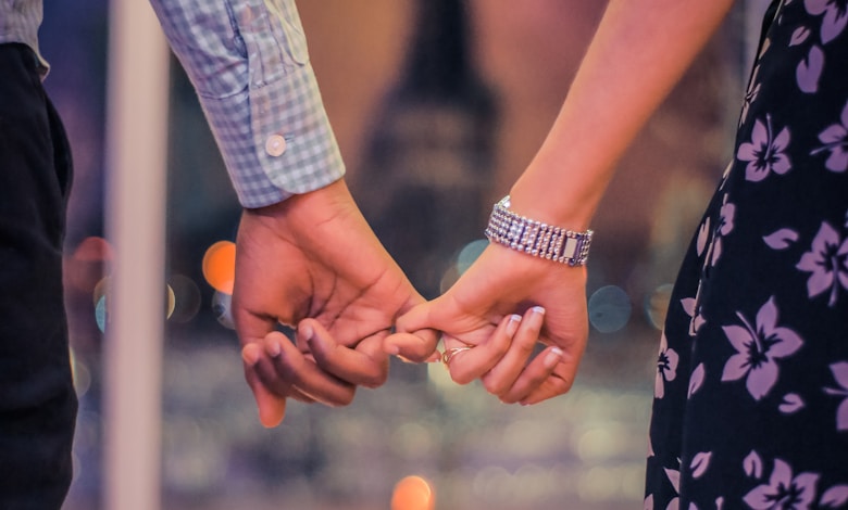 man and woman holding hands