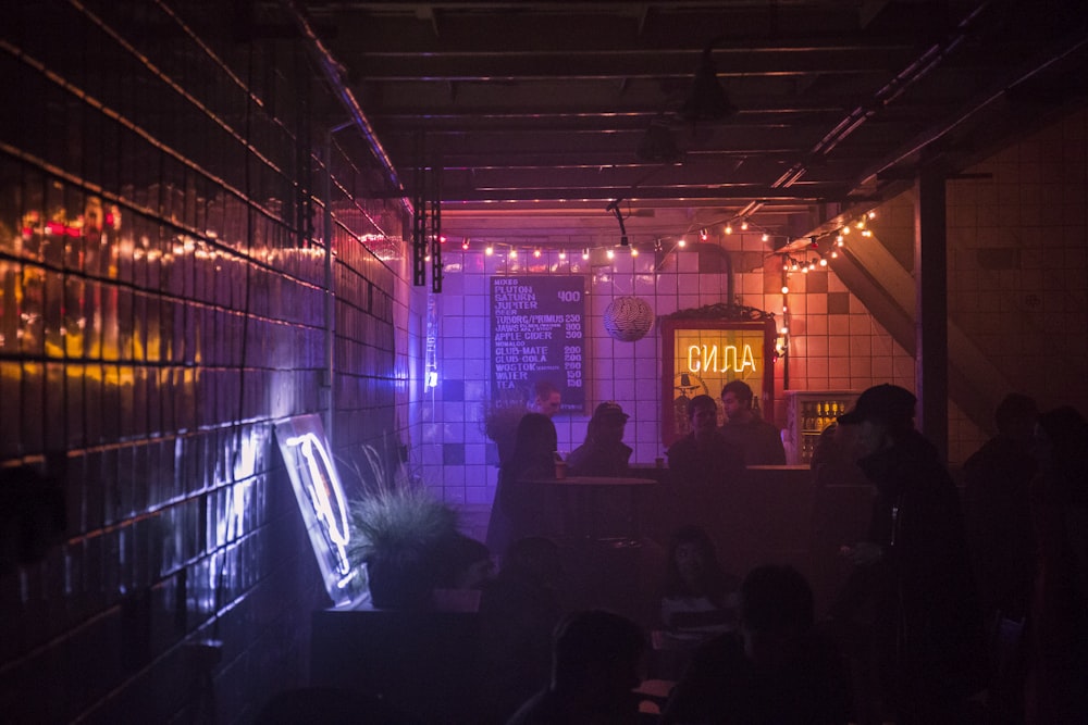 Pink And Red Lighted Dark Pub Interior Photo Free Person