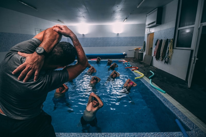 Seniors participating in a water aerobics class — gentle pool exercises for joint-friendly fitness and mobility after 65