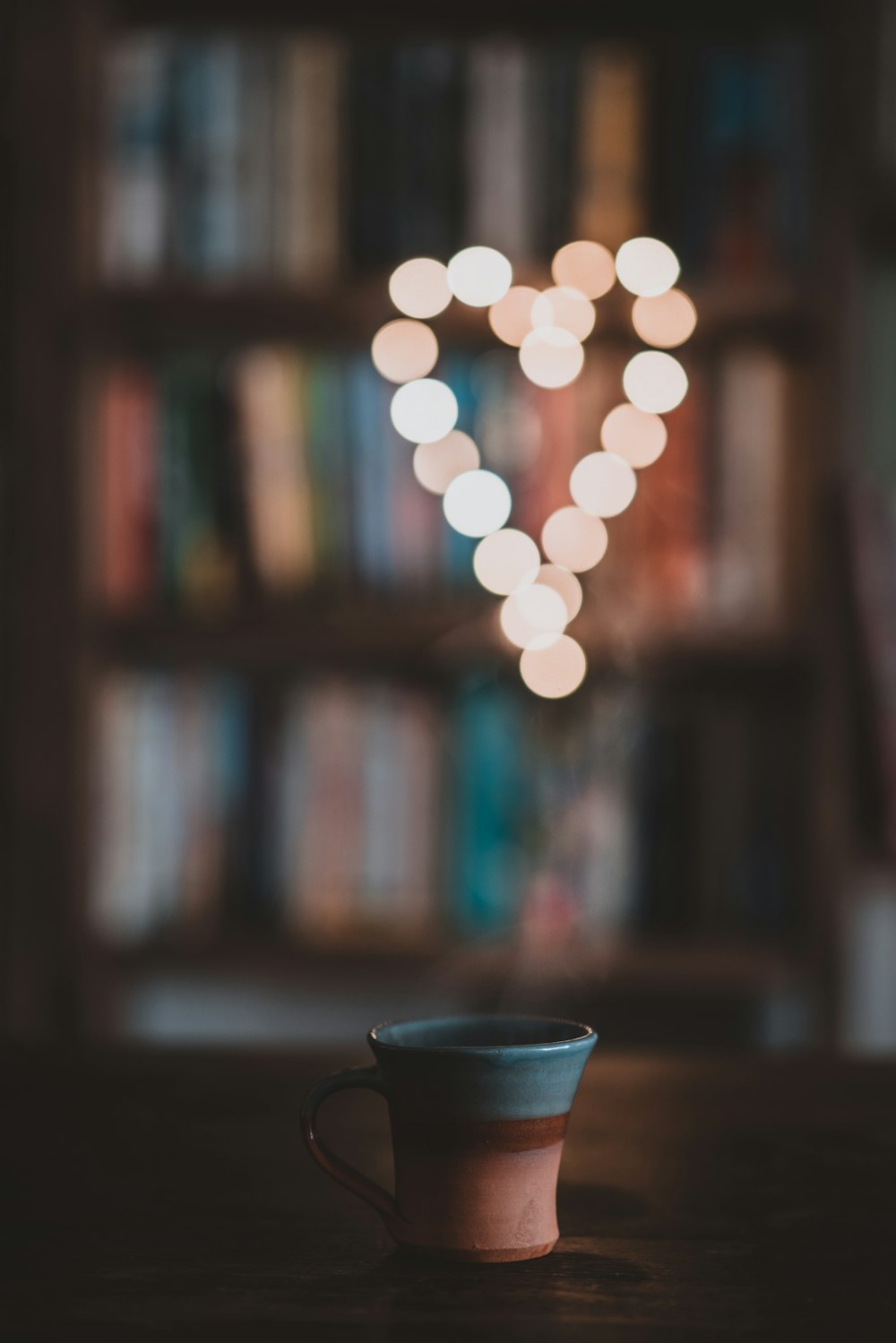 a coffee cup sitting on top of a wooden table