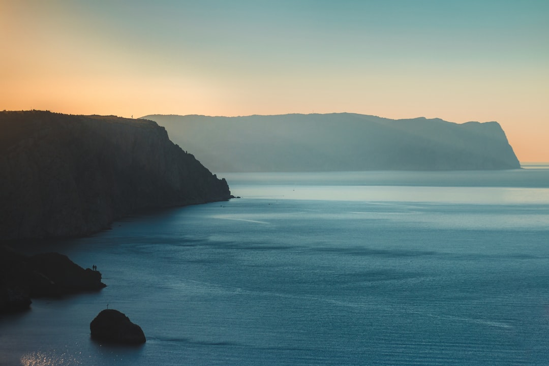 silhouette photography of cliffs