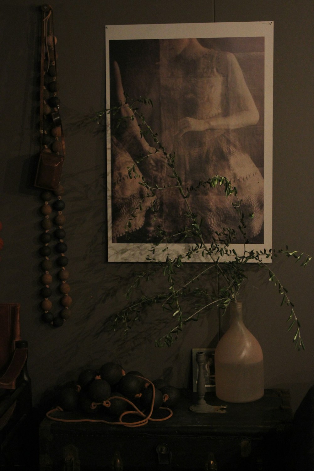 black baubles near white plastic bottle with plant on table