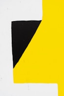 a black and yellow square with a white rectangle