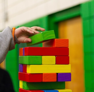 person piling blocks