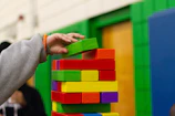 person piling blocks