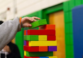 person piling blocks